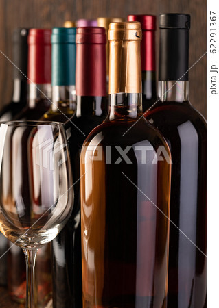 Row of vintage wine bottles 62291367