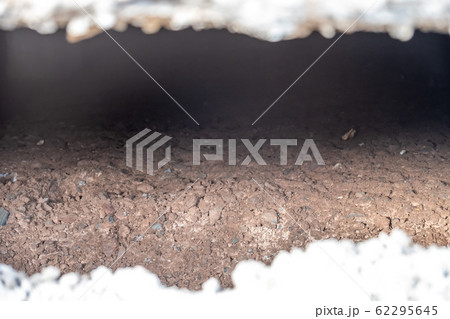 Subsidence under a house caused by a broken water service pipe Subsidence under a house caused by a broken water service pipe 62295645
