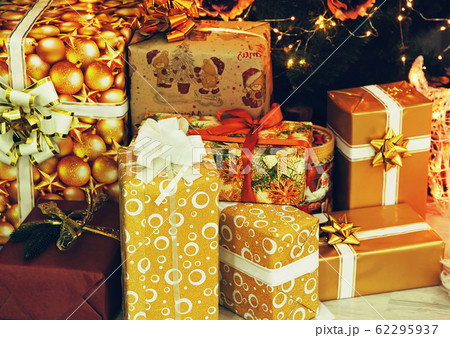 Christmas gift boxes near Christmas fir-tree. Christmas gift boxes near Christmas fir-tree. 62295937