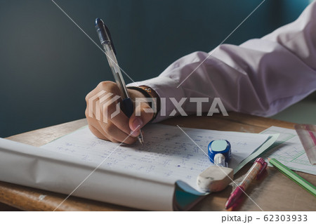 Hand and writing during the exam of a student. 62303933
