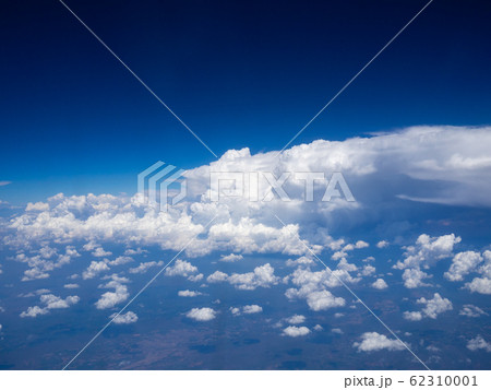 view from the airplane window, above the clouds 62310001