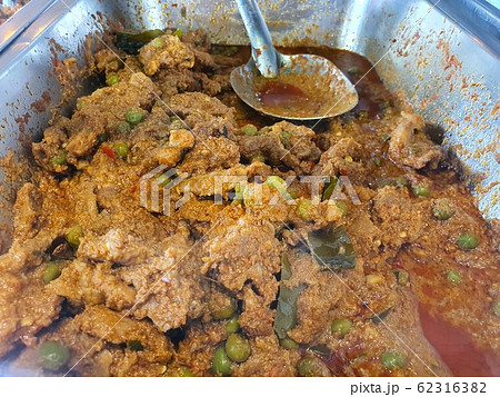 Picture is close-up to Thai style red curry with beef menu or Thai name is panaeng neur. Beef menu with coconut milk. Panaeng Curry with Pork in stainless steel mixer large bowl. 62316382
