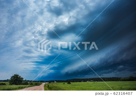 Storm clouds with shelf cloud and intense rain Storm clouds with shelf cloud and intense rain 62316407