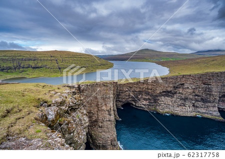 Sorvagsvatn lake cliffs over the ocean in Faroe Islands 62317758