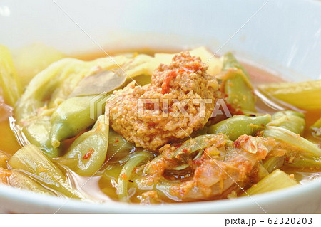 boiled mixed vegetable and fish egg in Thai spicy soup on bowl 62320203