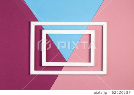 Multicolored paper with empty picture frame. flat layout with copy space. 62320287