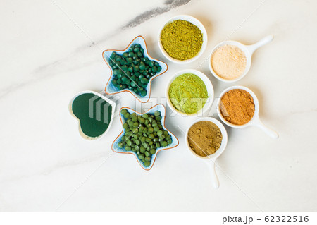 Top view of various dietary supplements in bowls 62322516