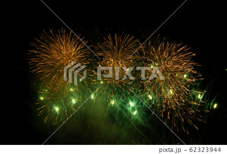 Colored firework background with free space for text. Colorful fireworks at night light up the sky. 62323944