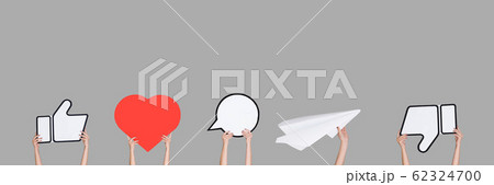 Hands holding the signs of social media on grey studio background, flyer Hands holding the signs of social media on grey studio background, flyer 62324700