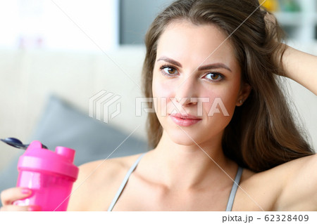 Beautiful girl holds sports water bottle, training Beautiful girl holds sports water bottle, training 62328409
