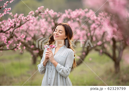A girl with closed eyes in the park A girl with closed eyes in the park 62329799
