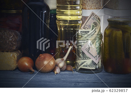 glass jar with paper dollars. against the 62329857