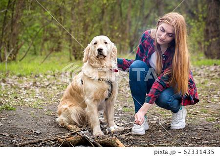Beautiful young woman with a dog Beautiful young woman with a dog 62331435