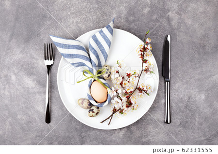 Easter table setting with egg in napkin Easter 62331555