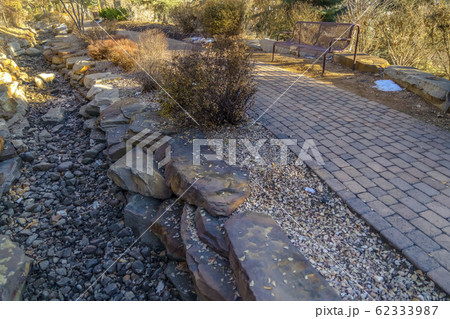 Brick pathway and rocky ground on a park in Provo 62333987
