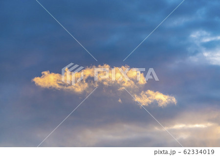 Puffy clouds illuminated by sunlight in the 62334019