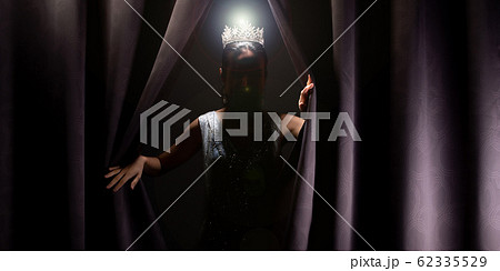 Miss Pageant Beauty Contest wears sequin Evening Gown long dress with sparkle Diamond Crown, Asian Woman opens purple Curtain after win Final round as new way life, opportunity, change everything 62335529