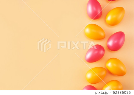Colorful background with orange and red Easter eggs Colorful background with orange and red Easter eggs 62336056