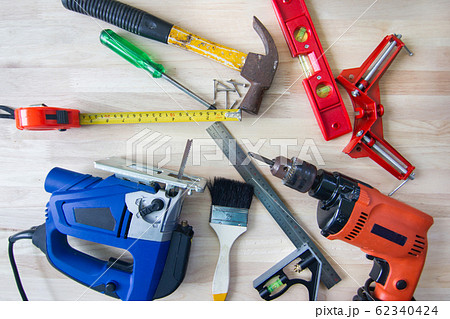 Electric drill, nut, tape measure, electric saw, ruler, screwdriver,hammer, object Tools for woodworking, concept woodwork Furniture . Electric drill, nut, tape measure, electric saw, ruler, screwdriver,hammer, object Tools for woodworking, concept woodwork Furniture . 62340424