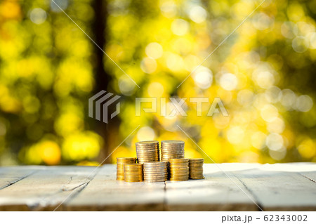 Coins lined up On a white wooden floor Orange and Coins lined up On a white wooden floor Orange and 62343002