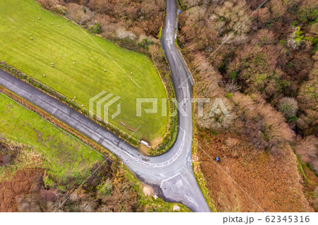 Curved bending road on the Wild Atlantic Way in Ireland. Curved bending road on the Wild Atlantic Way in Ireland. 62345316