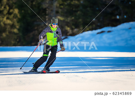 Skier while practicing technical ski exercises 62345869