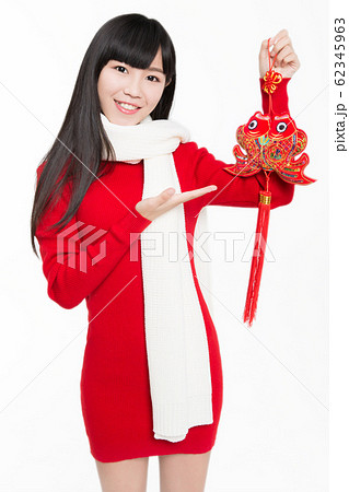 pretty girl holding chinese new year decoration 62345963