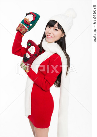 pretty woman holding christmas stockings 62346039