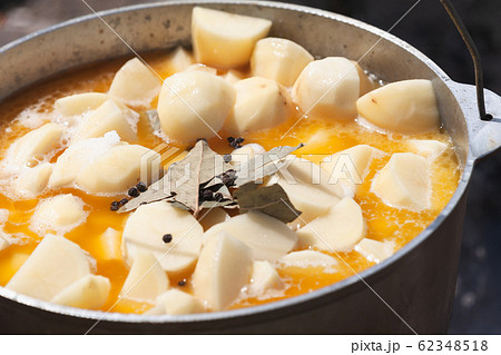 Spicy tourist soup with potato boils in a cauldron Spicy tourist soup with potato boils in a cauldron 62348518