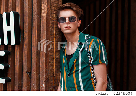 young handsome stylish man with sunglasses young handsome stylish man with sunglasses 62349604