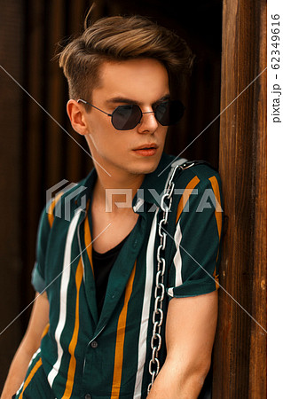 Handsome young man with sunglasses Handsome young man with sunglasses 62349616