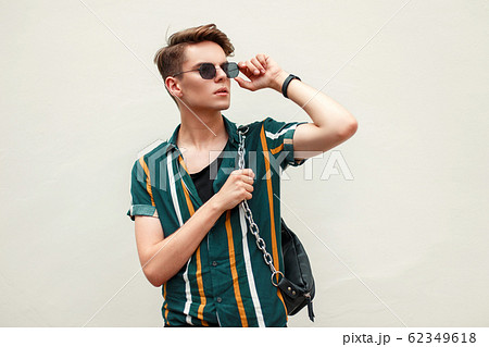 Handsome young man in a stylish beach shirt Handsome young man in a stylish beach shirt 62349618