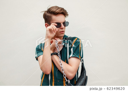 Young handsome man with a hairstyle Young handsome man with a hairstyle 62349620