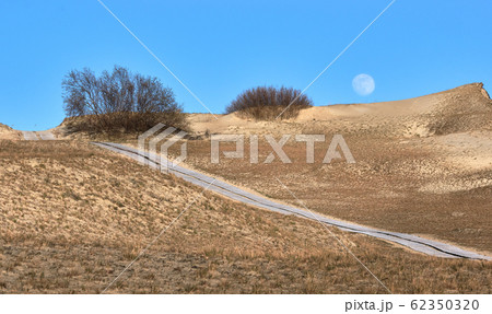 Sunset view of nordic dunes and Baltic sea at Curonian spit, Nida, Klaipeda, Lithuania 62350320