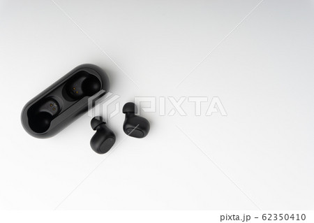 Wireless earbuds or earphones on white background 62350410