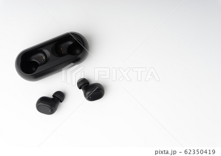 Wireless earbuds or earphones on white background 62350419
