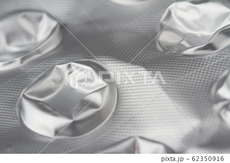 macro closeup of damaged medical pills blister 62350916