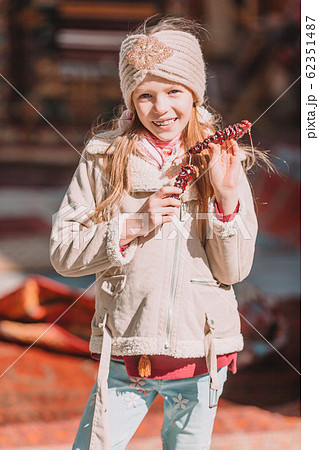Cute kid have fun in old street of the city 62351487