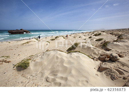 Sand dunes and tourists on tour viewing a 62356873