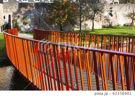 Red metal bridge to the old city wall in Vianen Red metal bridge to the old city wall in Vianen 62356901
