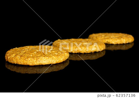 Sweet oat cookie isolated on black glass 62357136