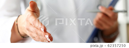 Female medicine doctor offering hand to shake Female medicine doctor offering hand to shake 62357250