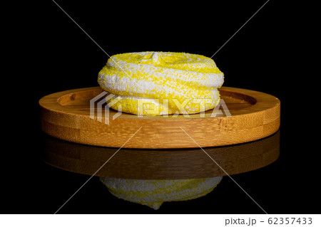 Sweet pastel meringue isolated on black glass Sweet pastel meringue isolated on black glass 62357433