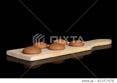 Chocolate sponge biscuit isolated on black glass 62357476