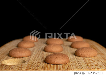 Chocolate sponge biscuit isolated on black glass 62357562