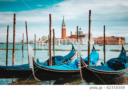 Venice, Italy. Close up of Gondolas and San Giorgio Maggiore church on Grand Canal in background Venice, Italy. Close up of Gondolas and San Giorgio Maggiore church on Grand Canal in background 62358309
