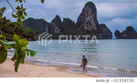 Lonely Traveler on Railay Beach in Krabi Thailand. Asia Lonely Traveler on Railay Beach in Krabi Thailand. Asia 62358720