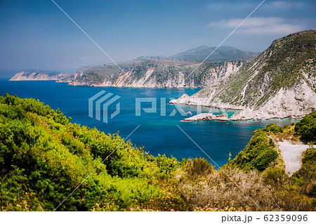 Coastline near Agia Eleni and Pitani beach in Kefalonia Island, Greece. Most beautiful rocky wild beaches with clear emerald water and high white limestone cliffs landscape 62359096