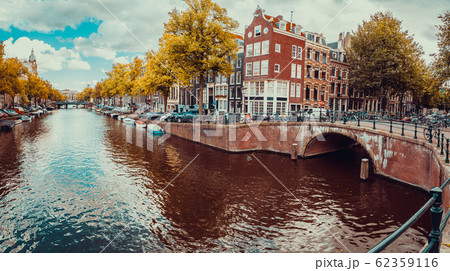 Romantic Amsterdam Canals With Bridges Boats の写真素材