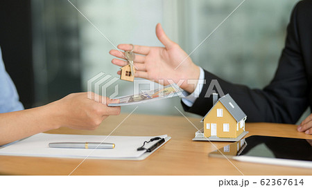 Close up view of real estate agent giving house 62367614